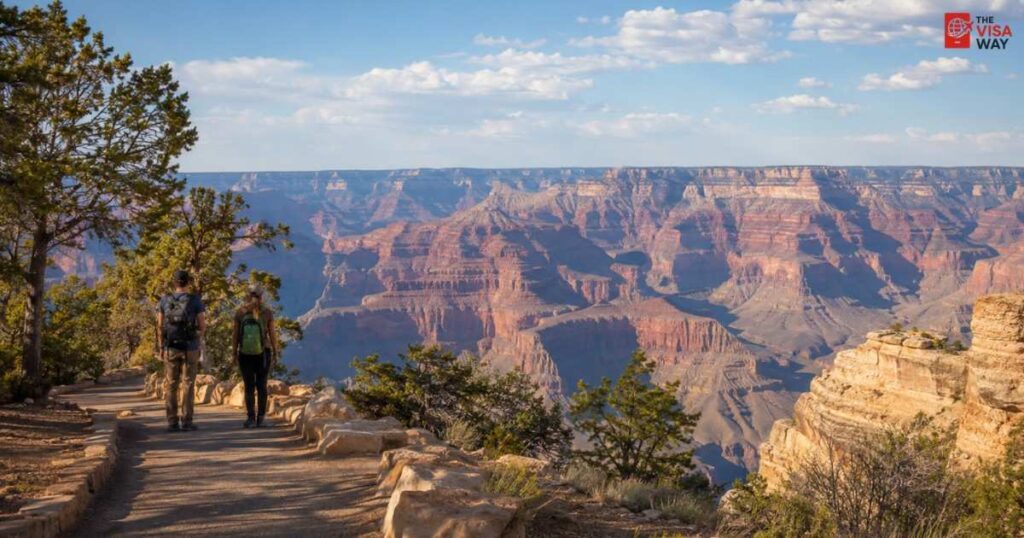 Visitors hiking along the South Rim trail at Grand Canyon National Park