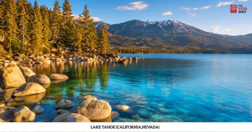 Crystal-clear Lake Tahoe with granite rocks, pine trees, and snow-dusted mountains